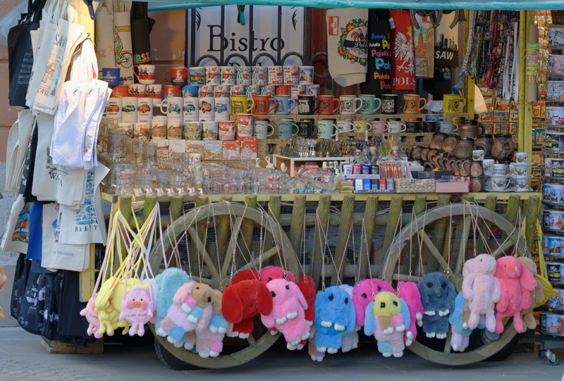 This is a souvenir stand selling mugs, bags, and plush toys in Warsaw, Poland